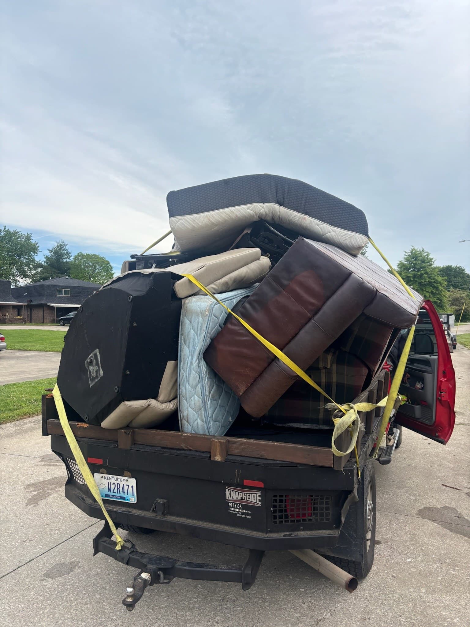 Truck securely loaded and strapped with furniture for removal